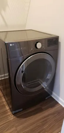 a utility room with washing machine