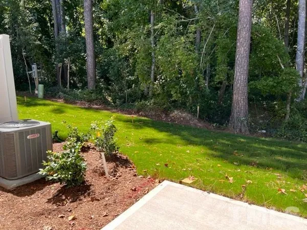 a view of a backyard with swimming pool