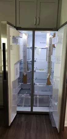 a view of walk in closet with clothes