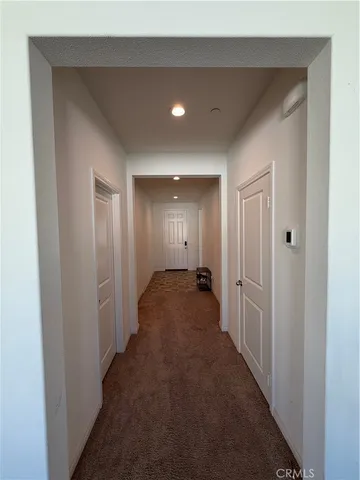 a view of hallway with closet