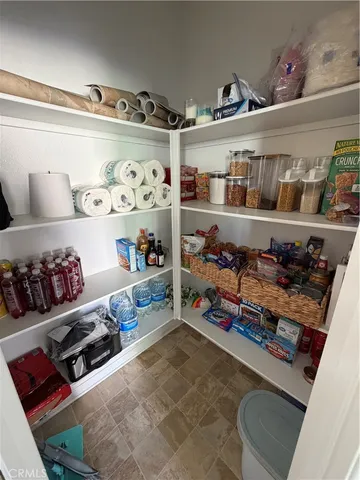 a room with storage and a lot of items