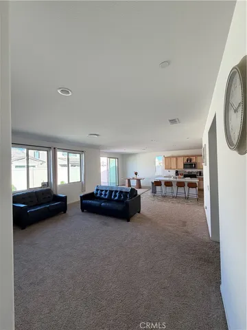 a view of livingroom with furniture and a window
