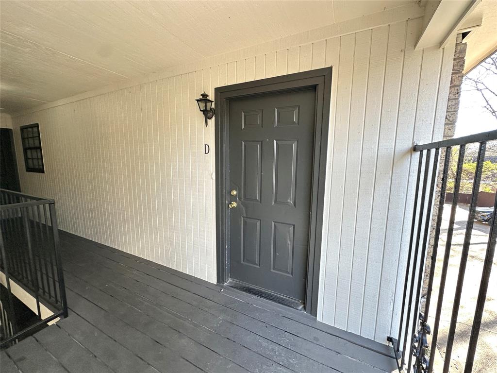 2006 Jane Street, Unit D Longview, TX 75601 - Photo 12 of 12 an empty room with wooden floor and windows
