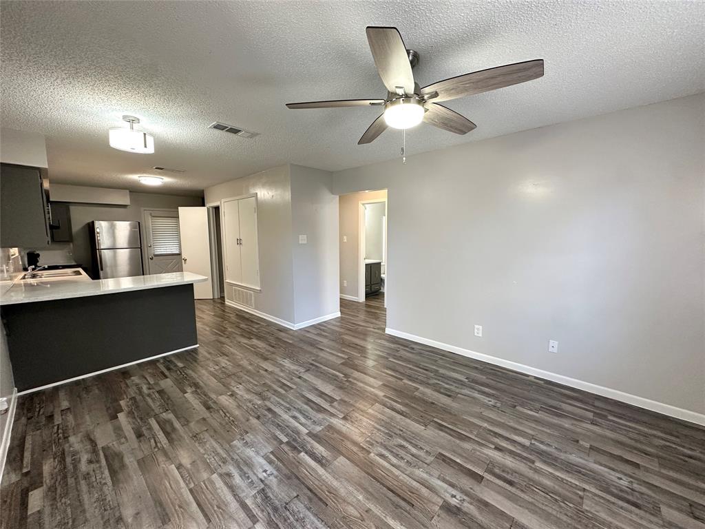 2006 Jane Street, Unit D Longview, TX 75601 - Photo 2 of 12 a view of a big room with wooden floor and a kitchen