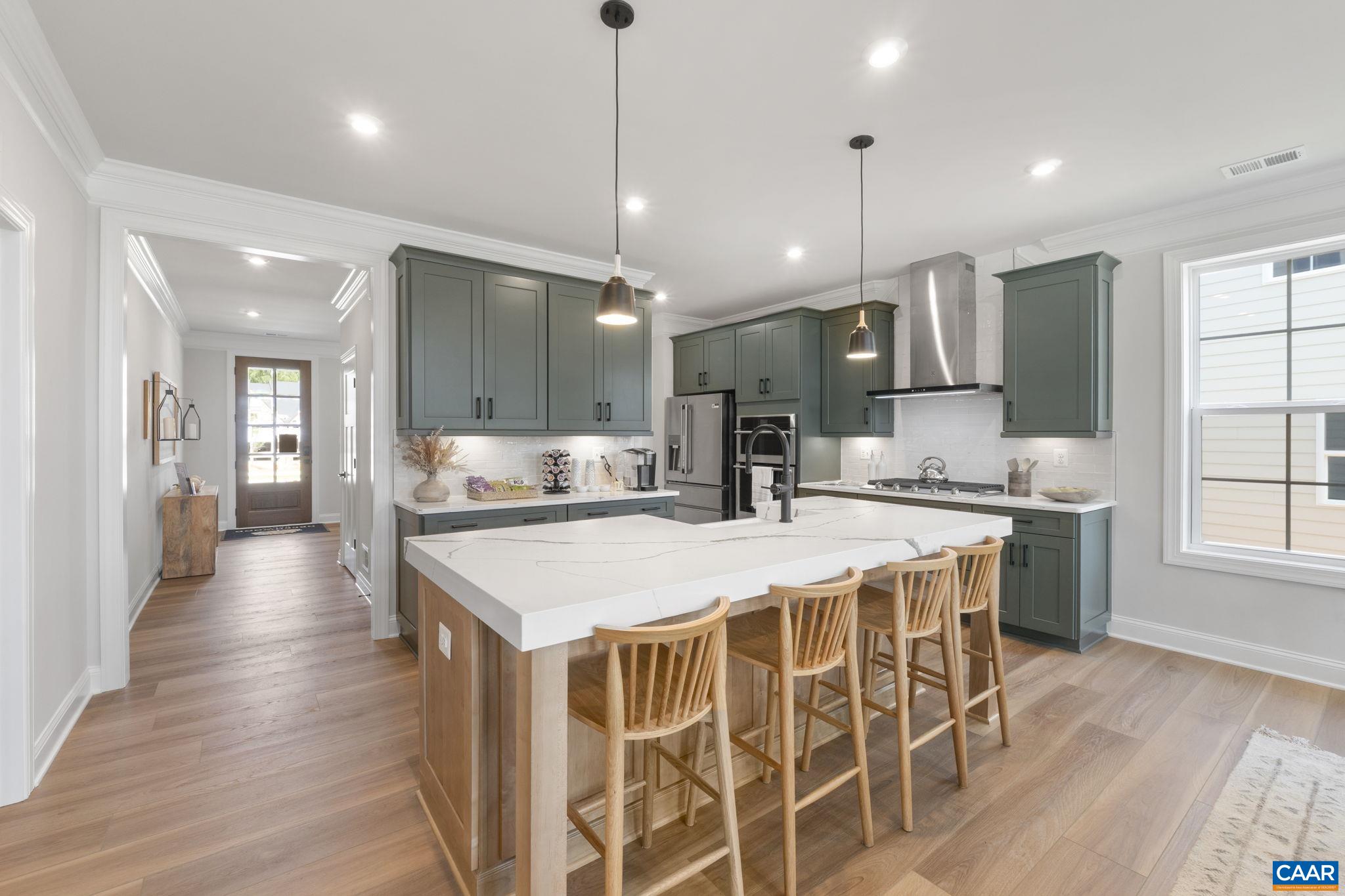109 Marcella Street Charlottesville, VA 22911 - Photo 14 of 49 a large kitchen with kitchen island a sink table and chairs