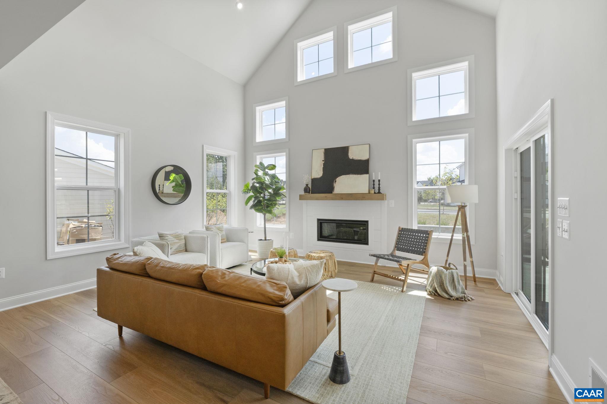109 Marcella Street Charlottesville, VA 22911 - Photo 18 of 49 a living room with furniture a fireplace and a window