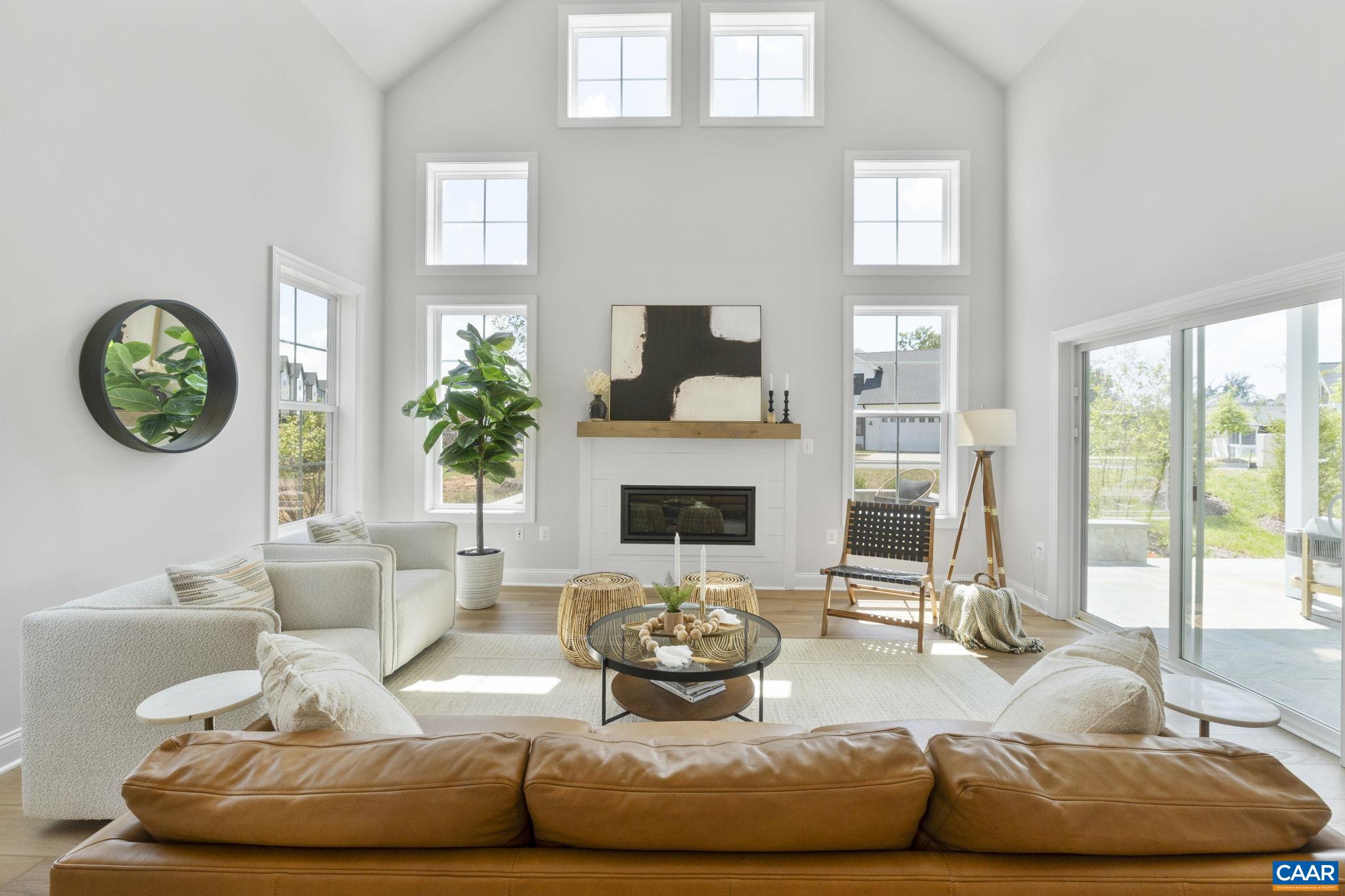 109 Marcella Street Charlottesville, VA 22911 - Photo 19 of 49 a living room with furniture a fireplace and a large window