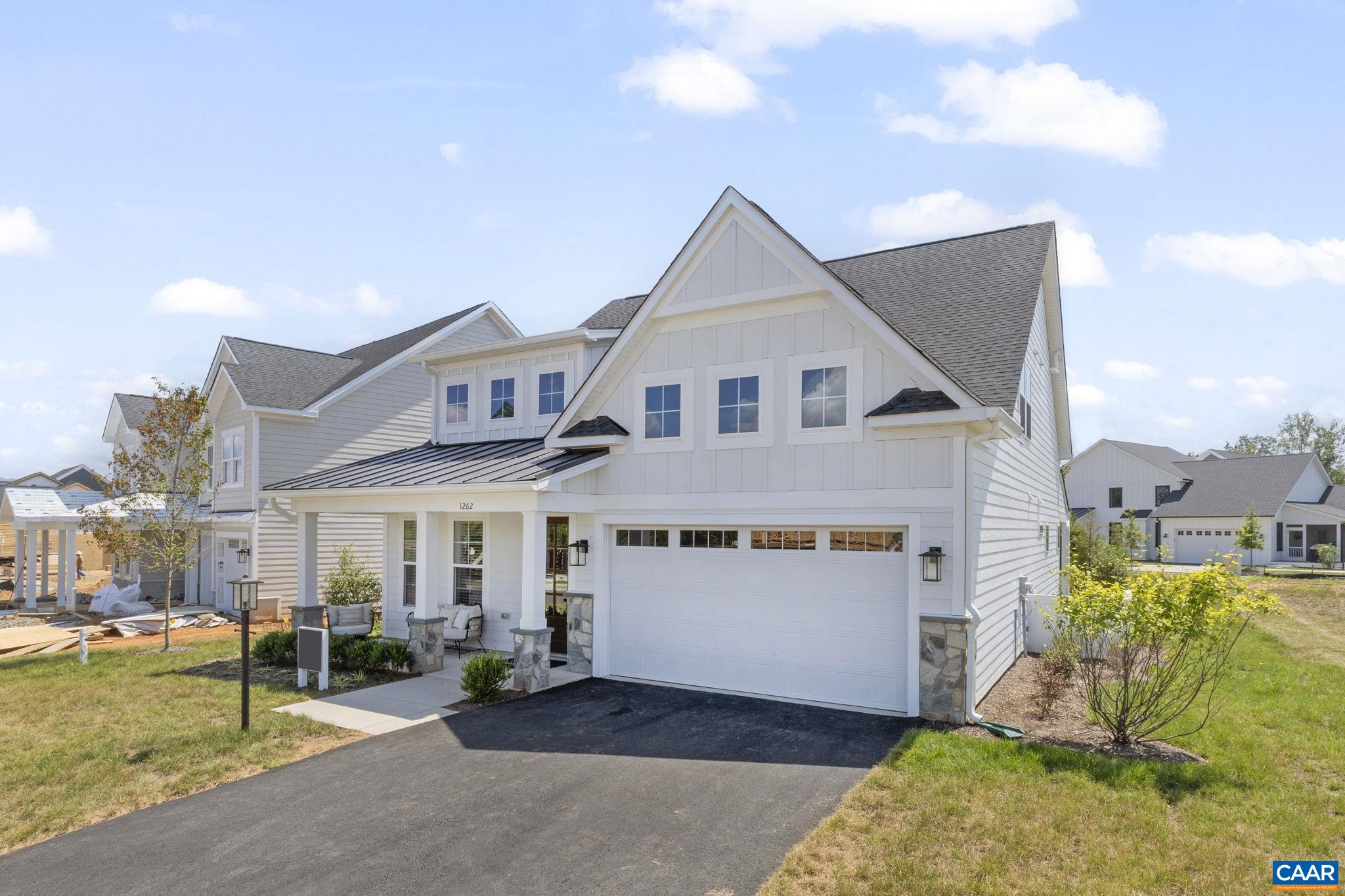 109 Marcella Street Charlottesville, VA 22911 - Photo 3 of 49 a view of a white house next to a yard with potted plants