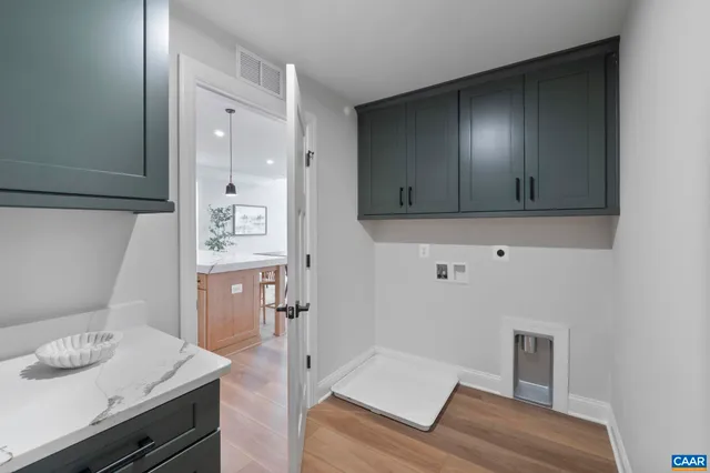 a view of kitchen with furniture and wooden floor