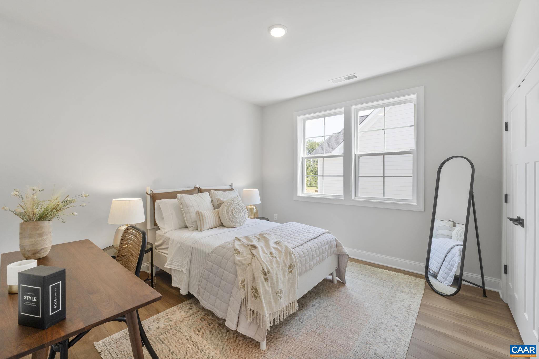 109 Marcella Street Charlottesville, VA 22911 - Photo 36 of 49 a bed room with a bed and a potted plant