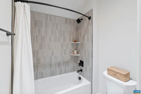a bathroom with a bathtub and shower