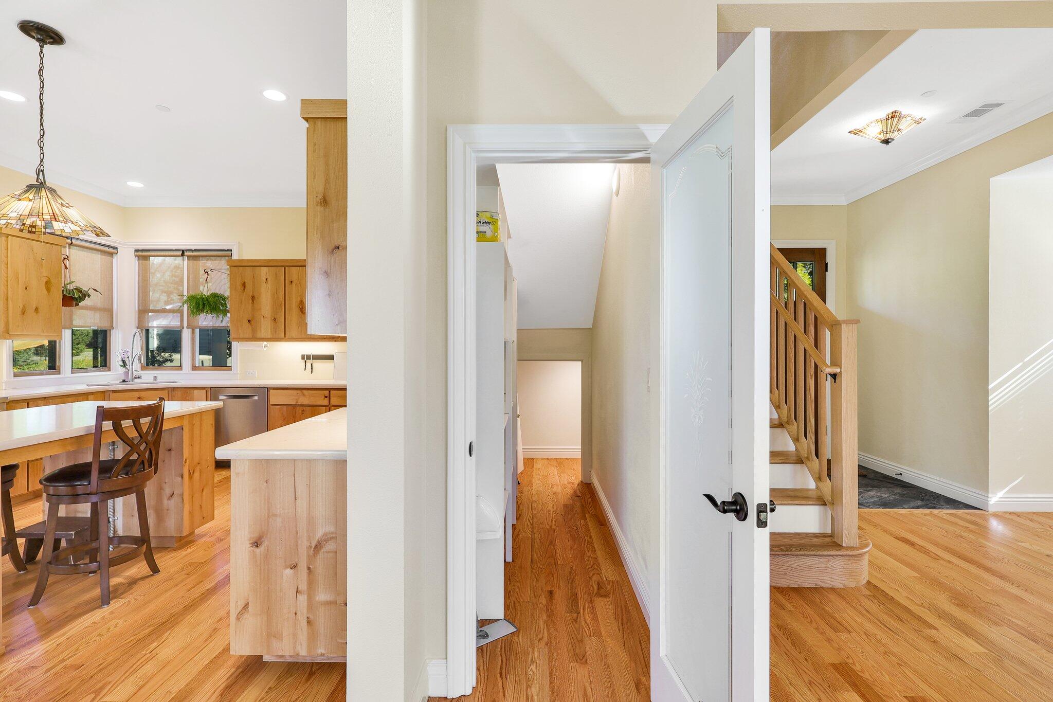 3211 Lake Redding Drive Redding, CA 96003 - Photo 16 of 68 a view of a hallway with wooden floor windows and a living room