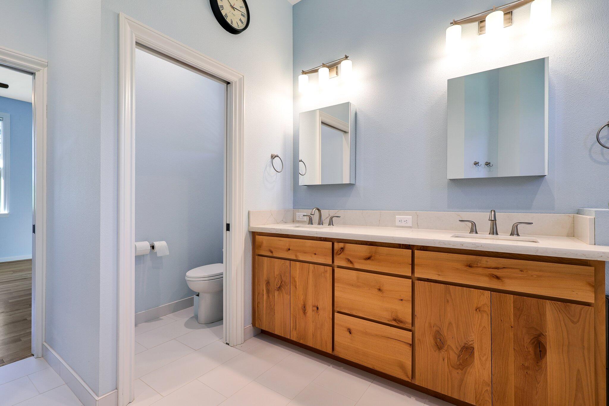 3211 Lake Redding Drive Redding, CA 96003 - Photo 22 of 68 a bathroom with a granite countertop sink mirror and toilet