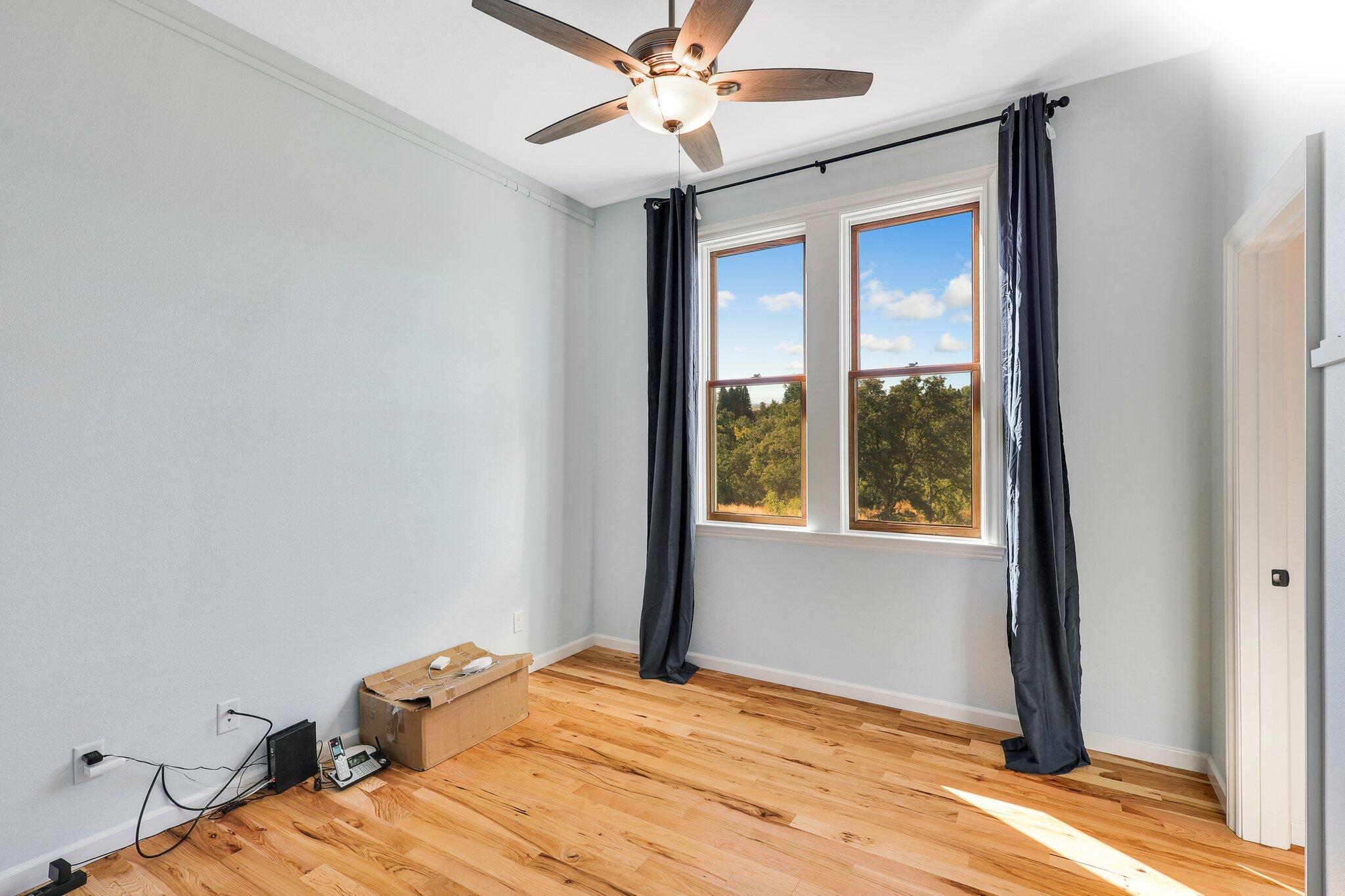 3211 Lake Redding Drive Redding, CA 96003 - Photo 25 of 68 a bedroom with a bed and a window