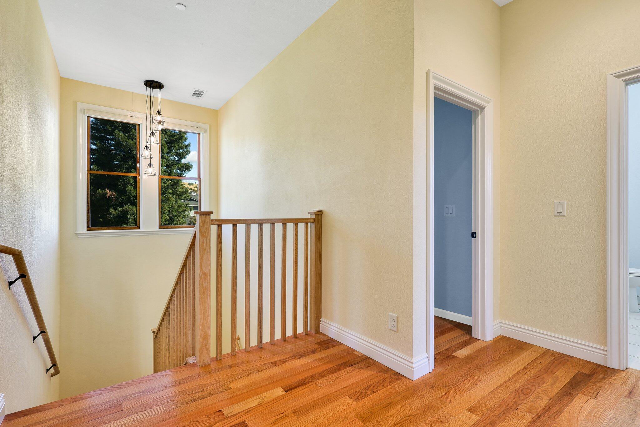 3211 Lake Redding Drive Redding, CA 96003 - Photo 33 of 68 an entryway of a room with wooden floor and windows