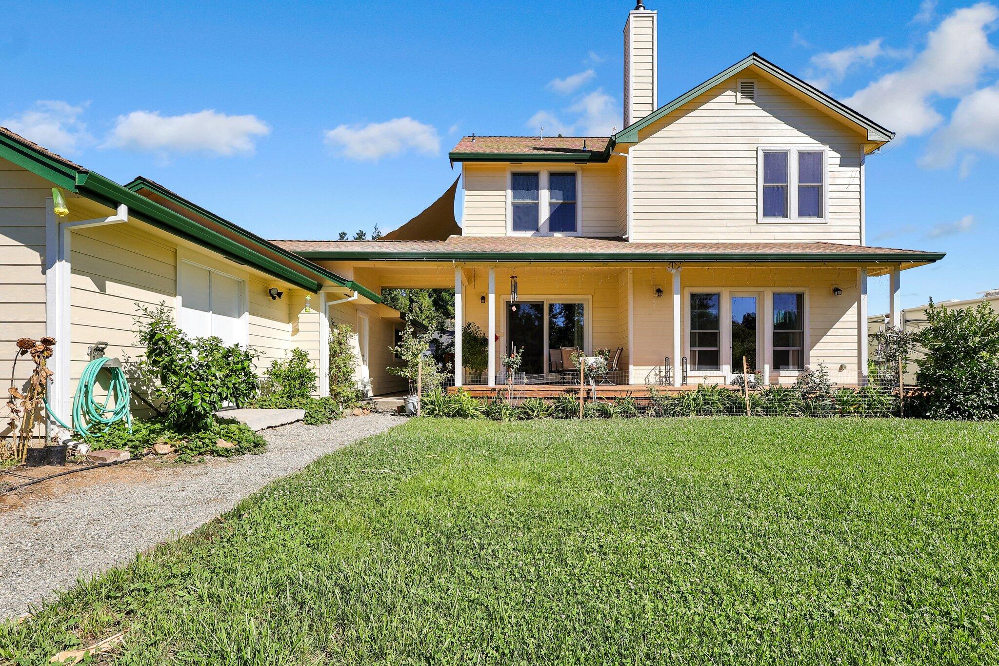 3211 Lake Redding Drive Redding, CA 96003 - Photo 49 of 68 a view of a house with a yard and sitting area