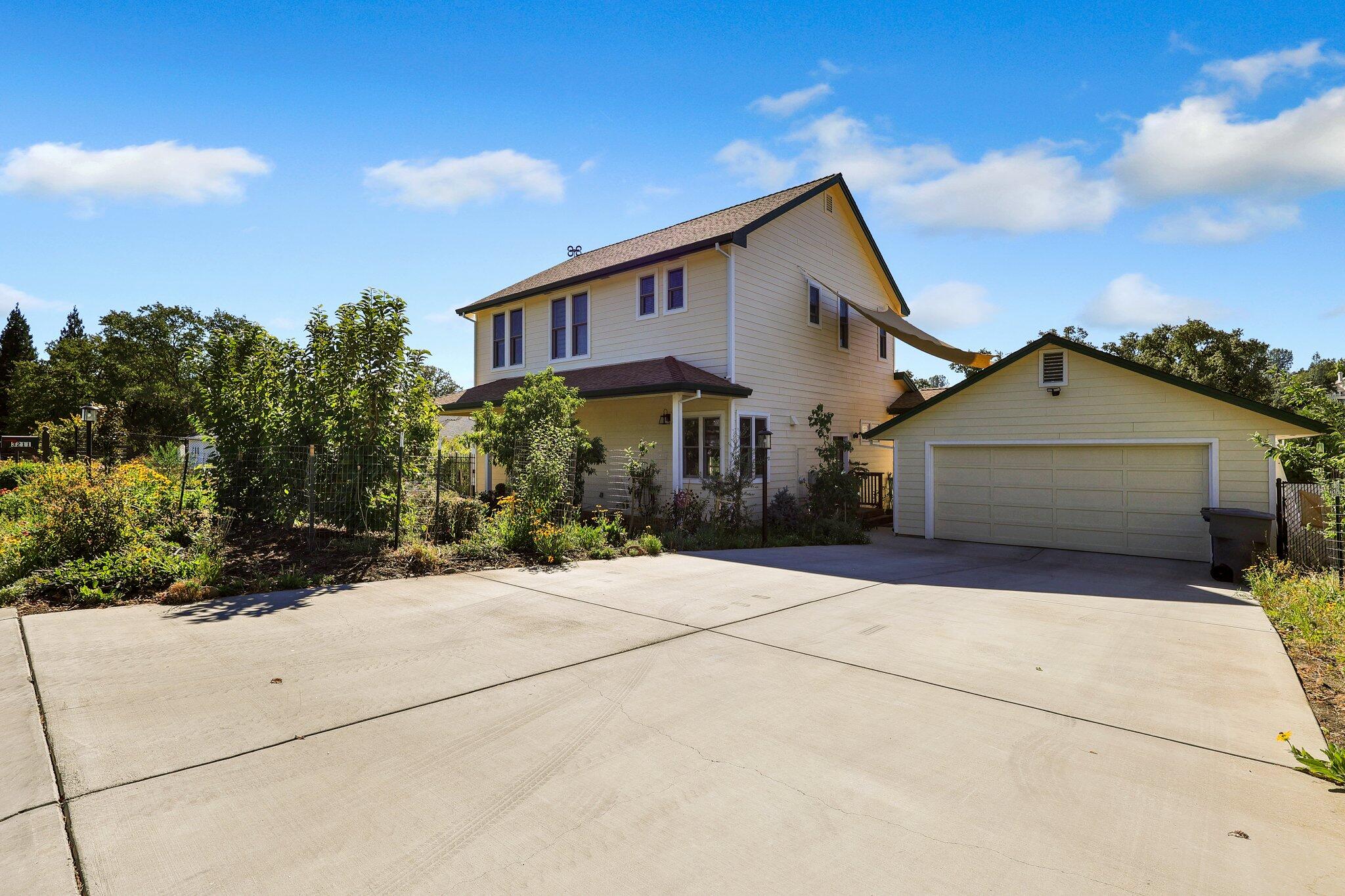 3211 Lake Redding Drive Redding, CA 96003 - Photo 54 of 68 a front view of a house with a yard and garage