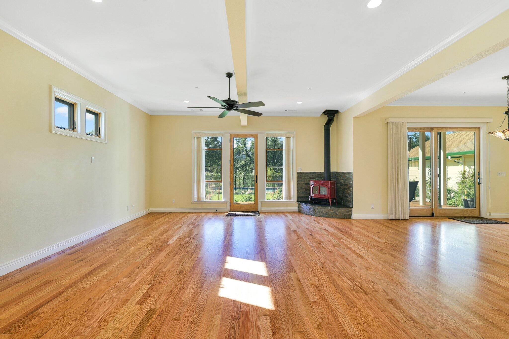 3211 Lake Redding Drive Redding, CA 96003 - Photo 6 of 68 a view of an empty room with wooden floor and a window