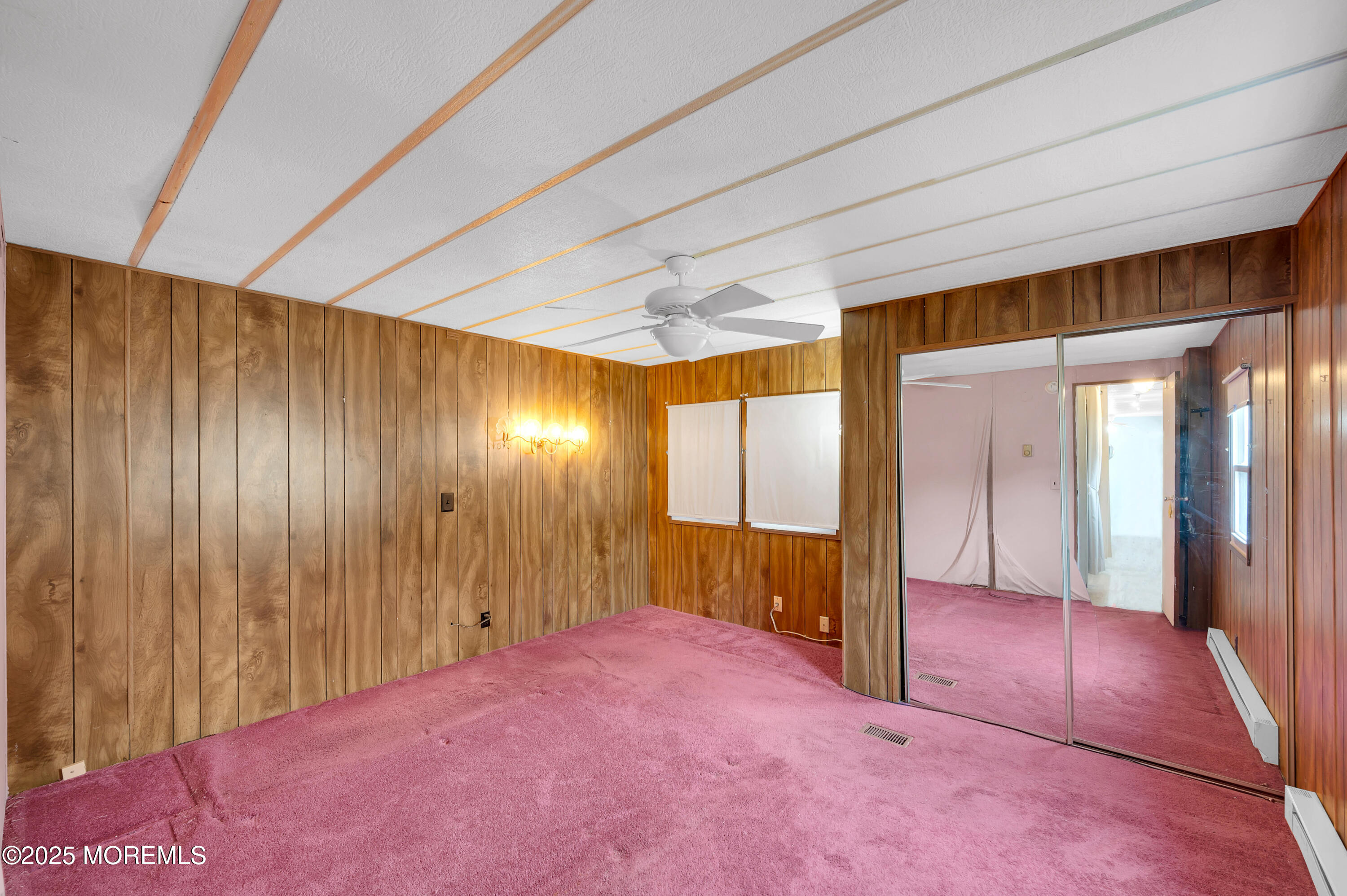 26 Raccoon Avenue Whiting, NJ 08759 - Photo 12 of 17 a view of hallway with an empty room and wooden floor