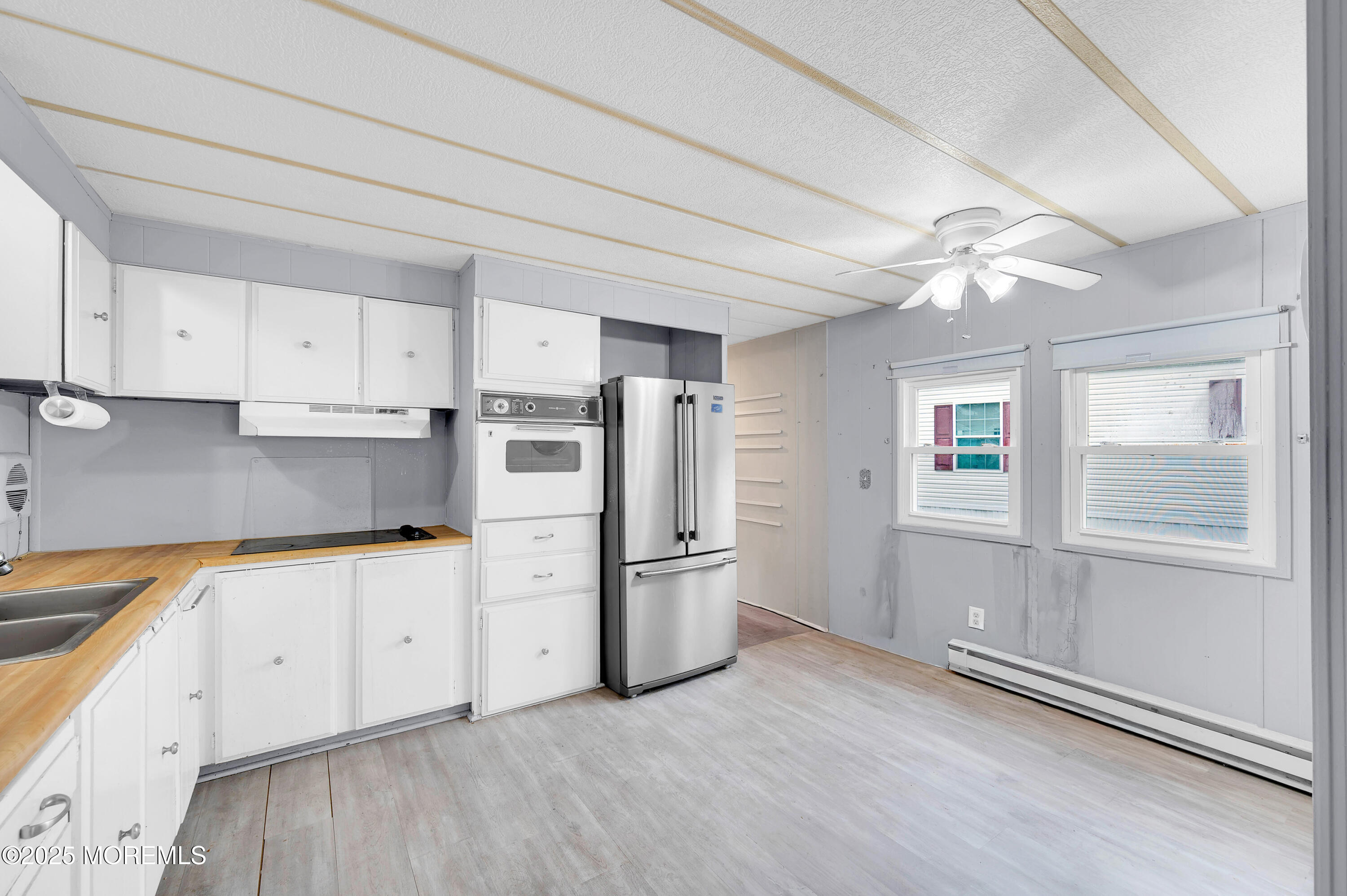 26 Raccoon Avenue Whiting, NJ 08759 - Photo 6 of 17 a kitchen with stainless steel appliances granite countertop a refrigerator and a stove top oven