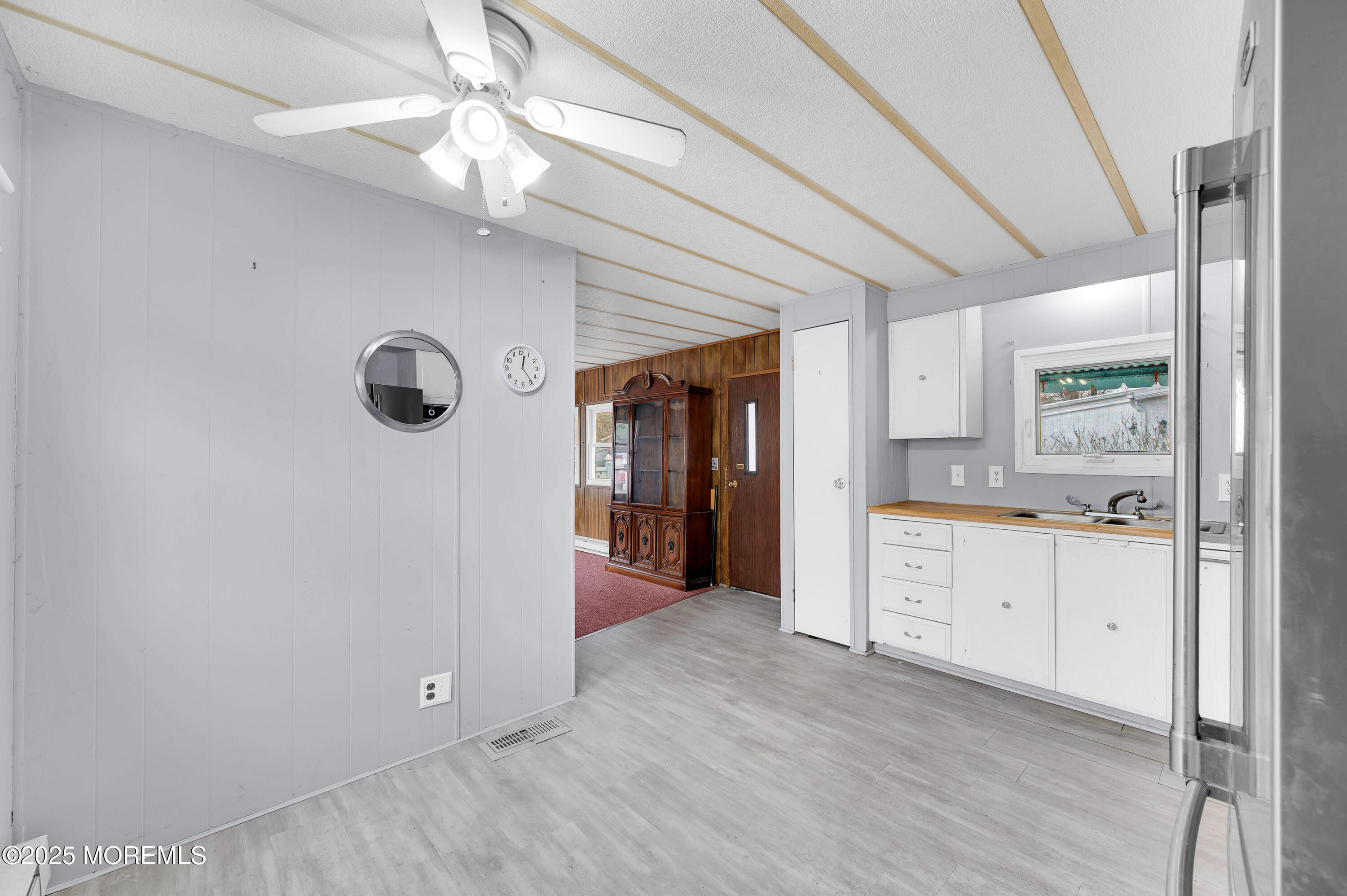 26 Raccoon Avenue Whiting, NJ 08759 - Photo 7 of 17 a view of a kitchen with a sink and a refrigerator