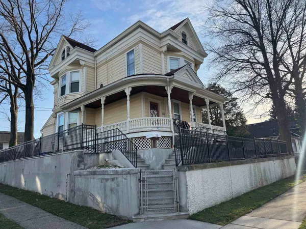 a front view of a house with a yard