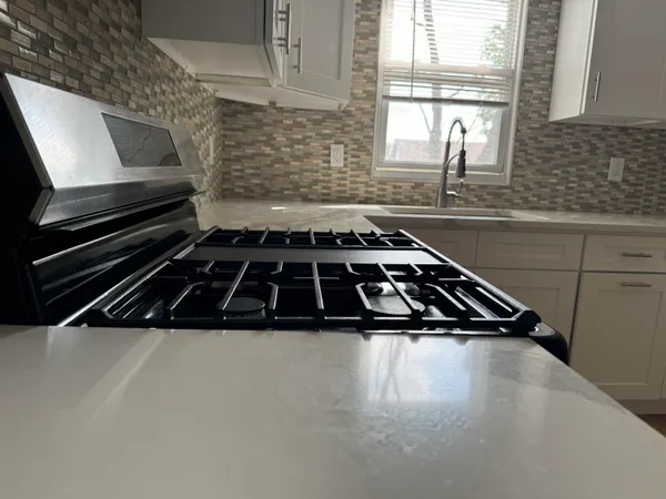 a kitchen with sink and window
