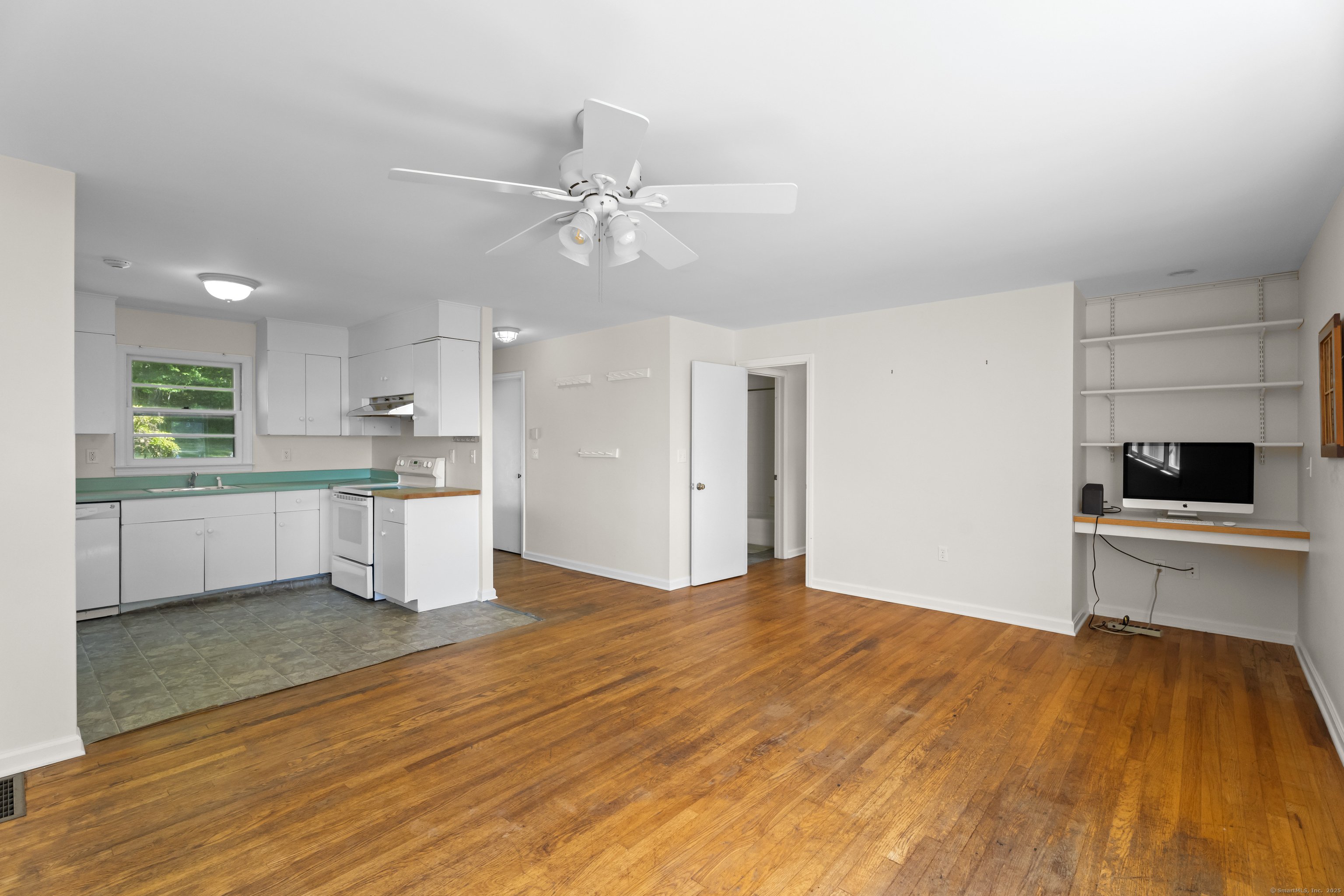 301 Osbrook Point Stonington, CT 06379 - Photo 28 of 39 a large white kitchen with kitchen island a sink stainless steel appliances and cabinets
