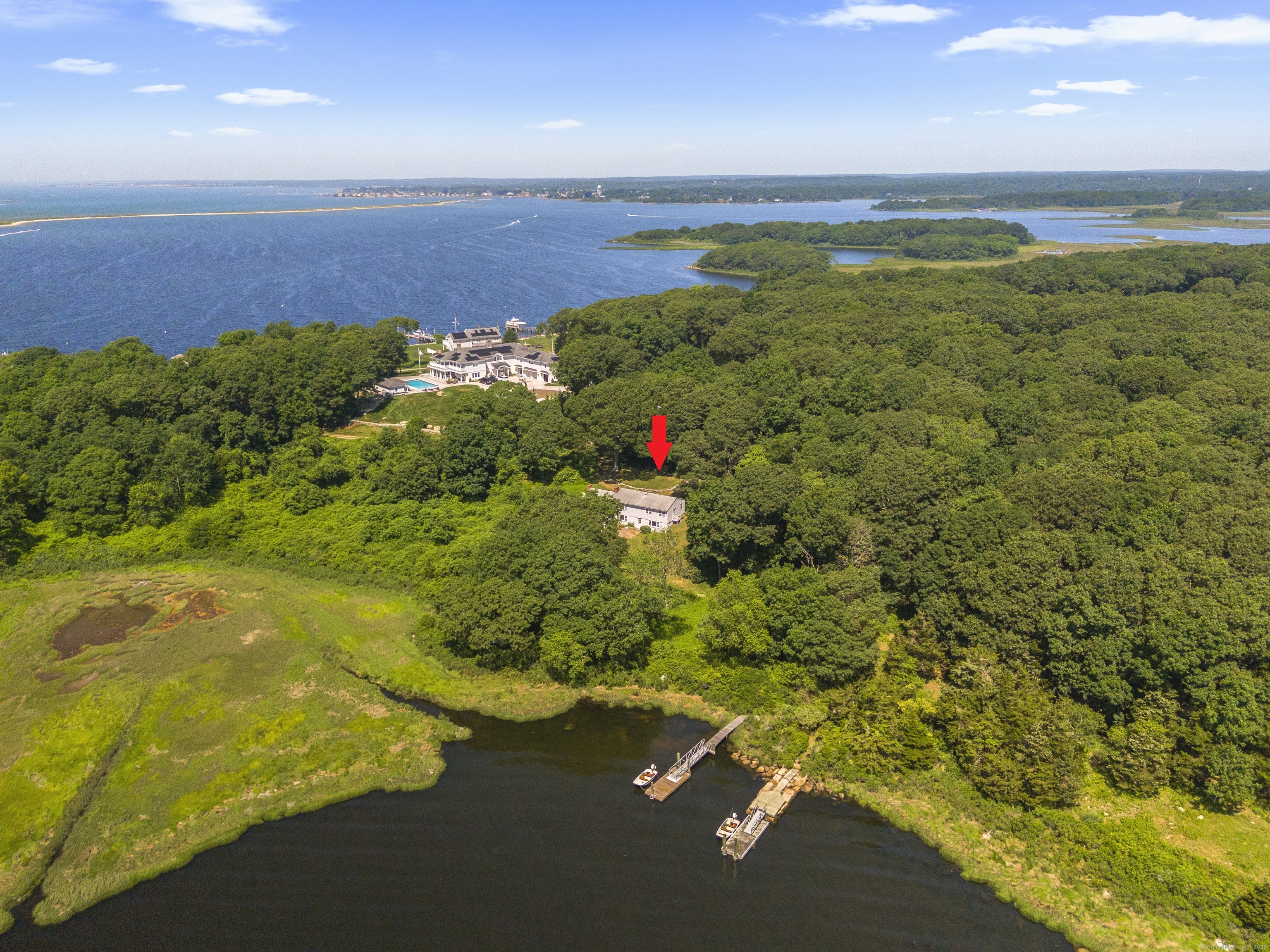 301 Osbrook Point Stonington, CT 06379 - Photo 7 of 39 a view of a lake with a yard