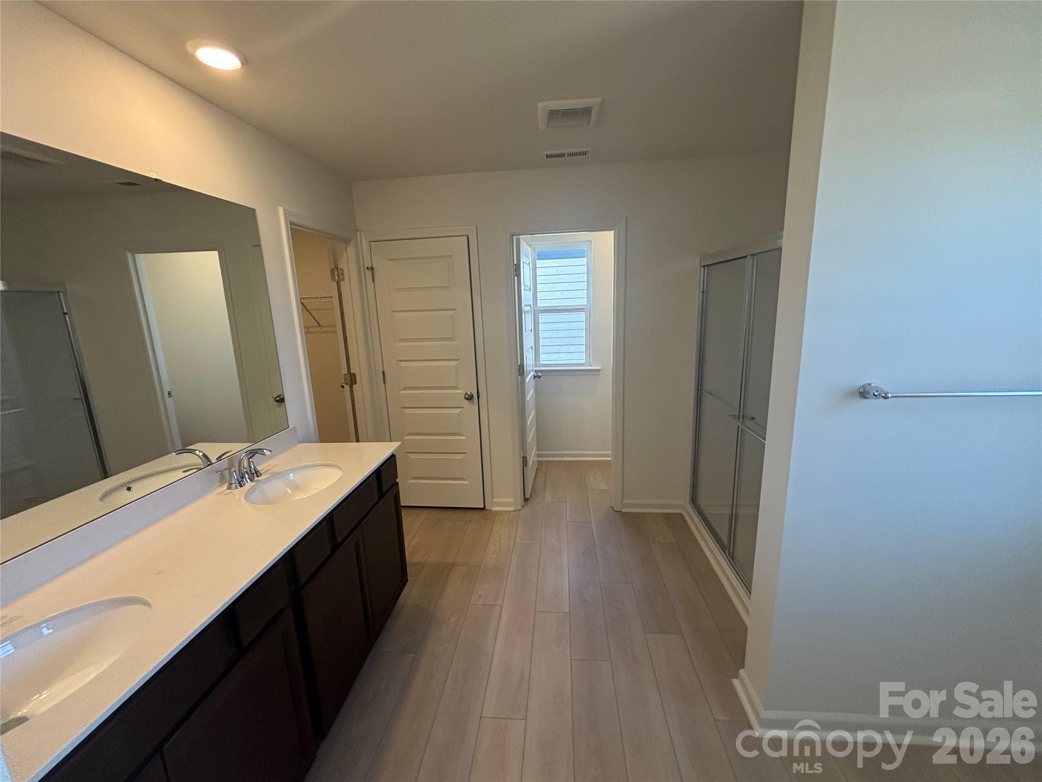 357 Roxanna Lane, Unit 72 York, SC 29745 - Photo 14 of 23 a bathroom with a sink a mirror and a shower