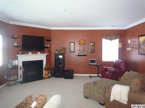 235 Sycamore Creek Road Fort Mill, SC 29708 - Photo 3 of 15 a living room with furniture a flat screen tv and a fireplace