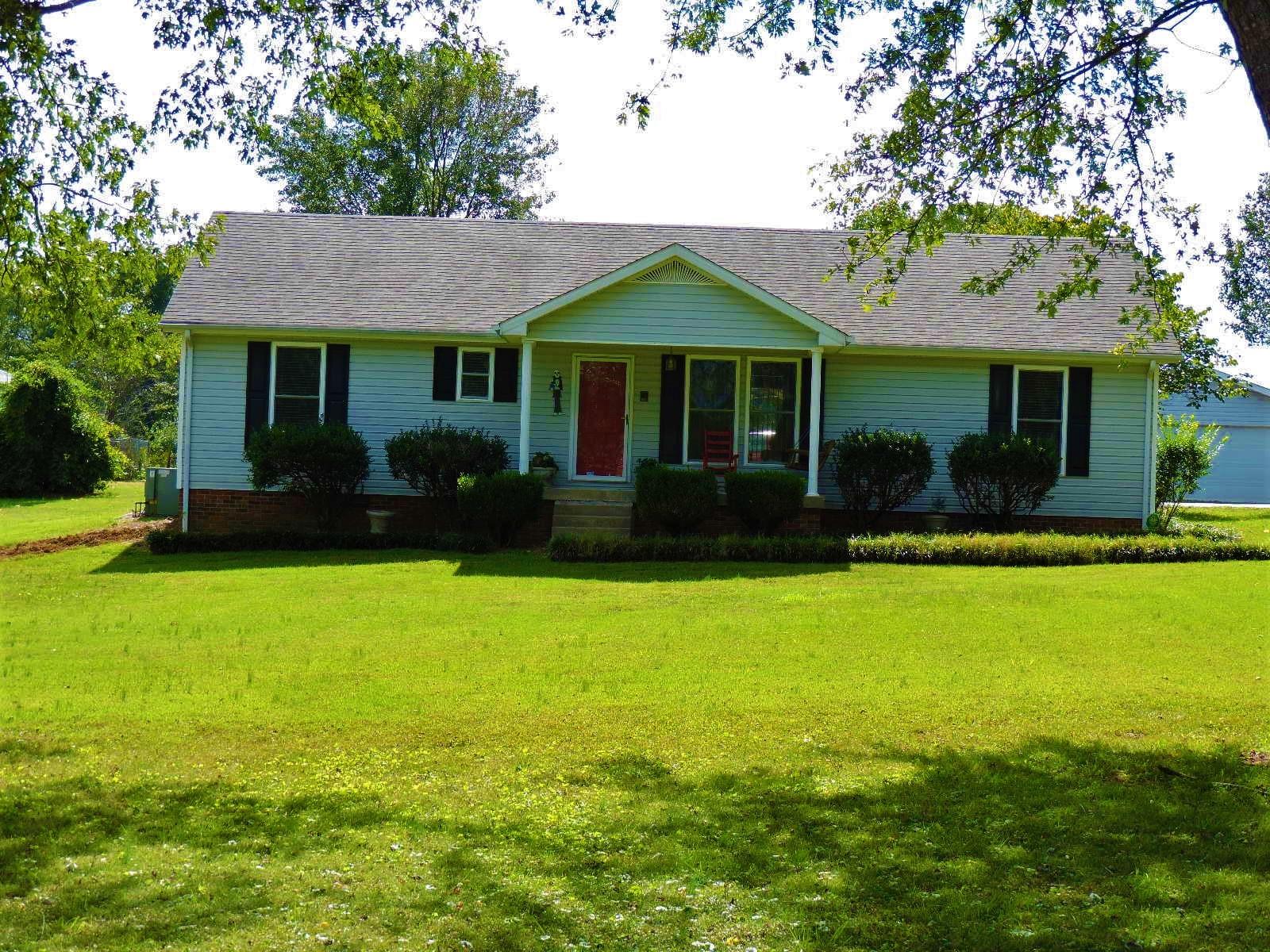 424 Goshen Road Lebanon, TN 37087 - Photo 1 of 29 a front view of a house with garden