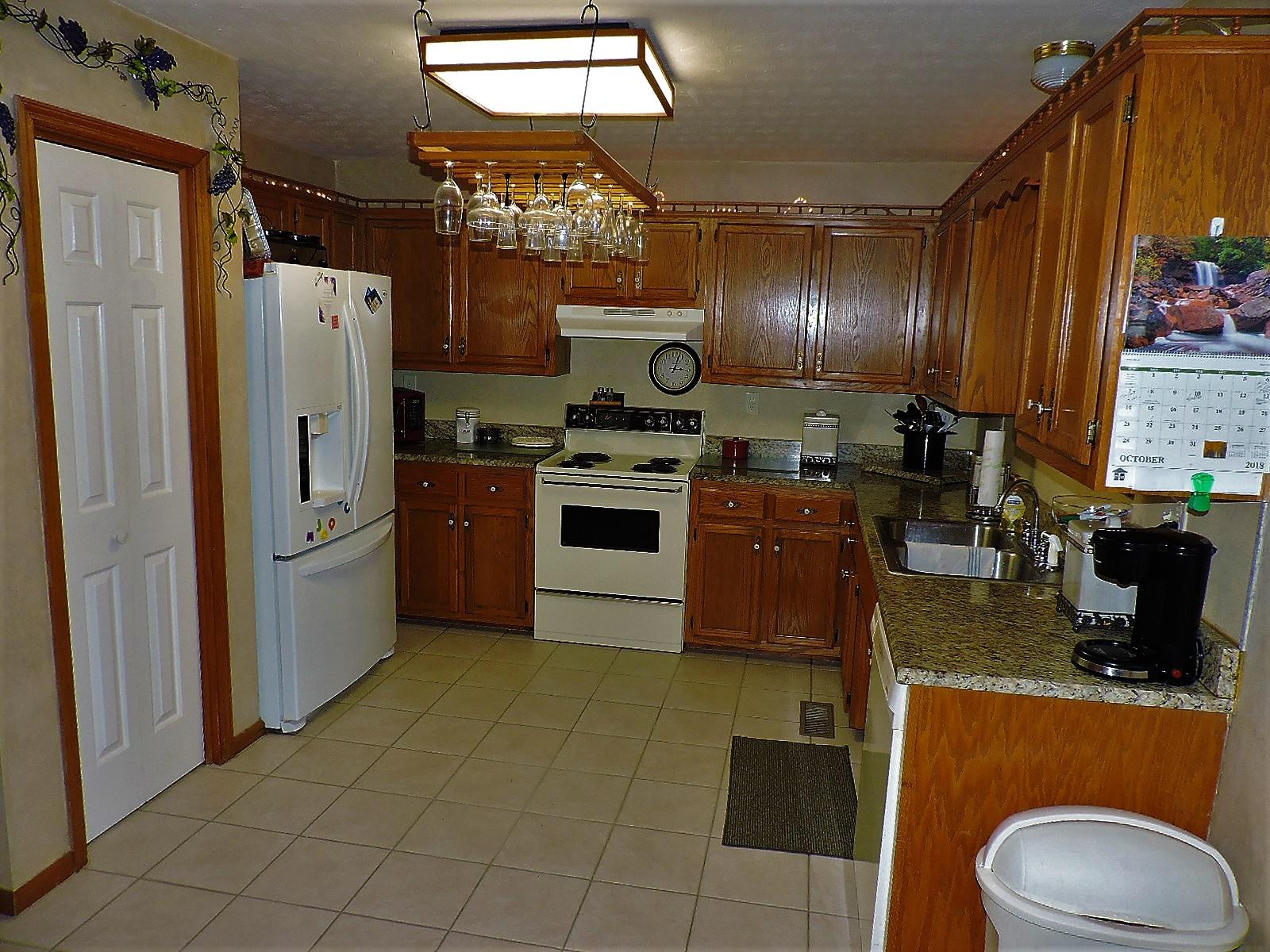 424 Goshen Road Lebanon, TN 37087 - Photo 19 of 29 a kitchen with stainless steel appliances granite countertop a refrigerator a stove and a sink