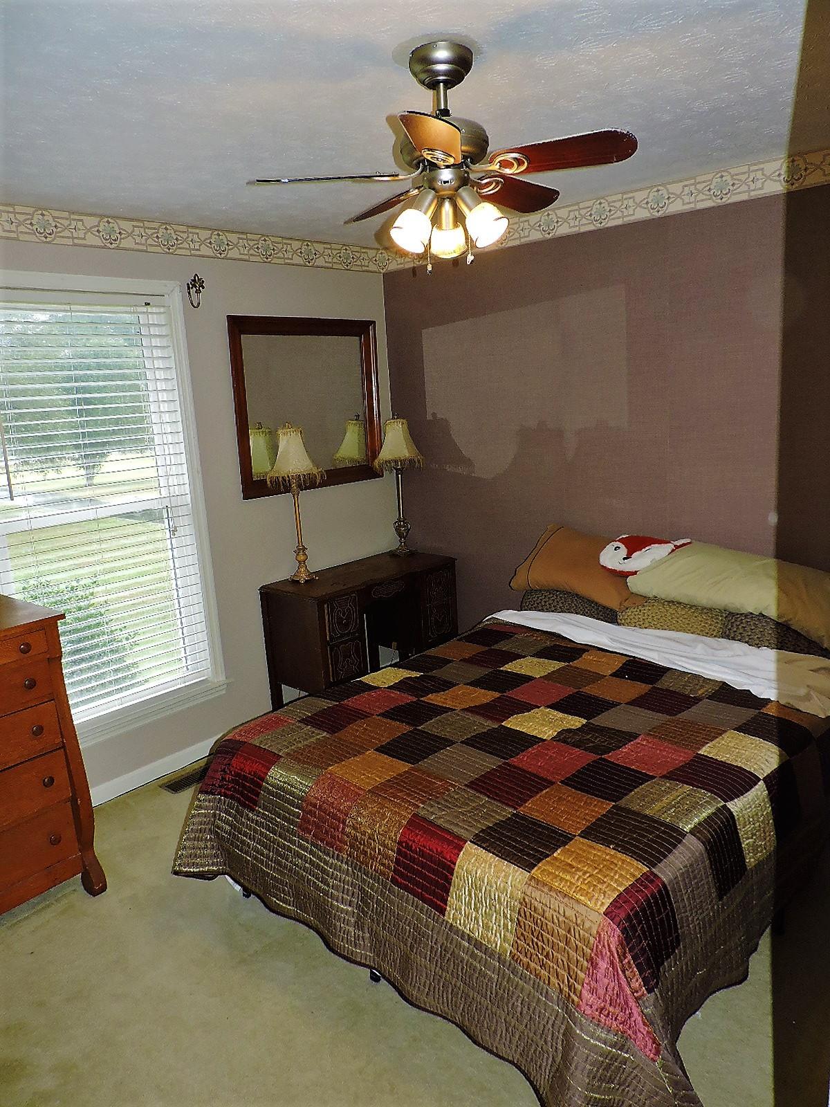424 Goshen Road Lebanon, TN 37087 - Photo 27 of 29 a bedroom with a bed and window