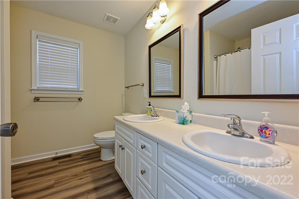 517 Kittiewake Lane Clover, SC 29710 - Photo 21 of 30 a bathroom with a double vanity sink mirror and toilet