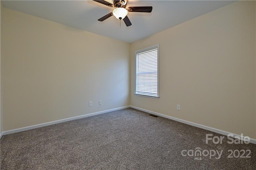 517 Kittiewake Lane Clover, SC 29710 - Photo 26 of 30 an empty room with a window and a fan