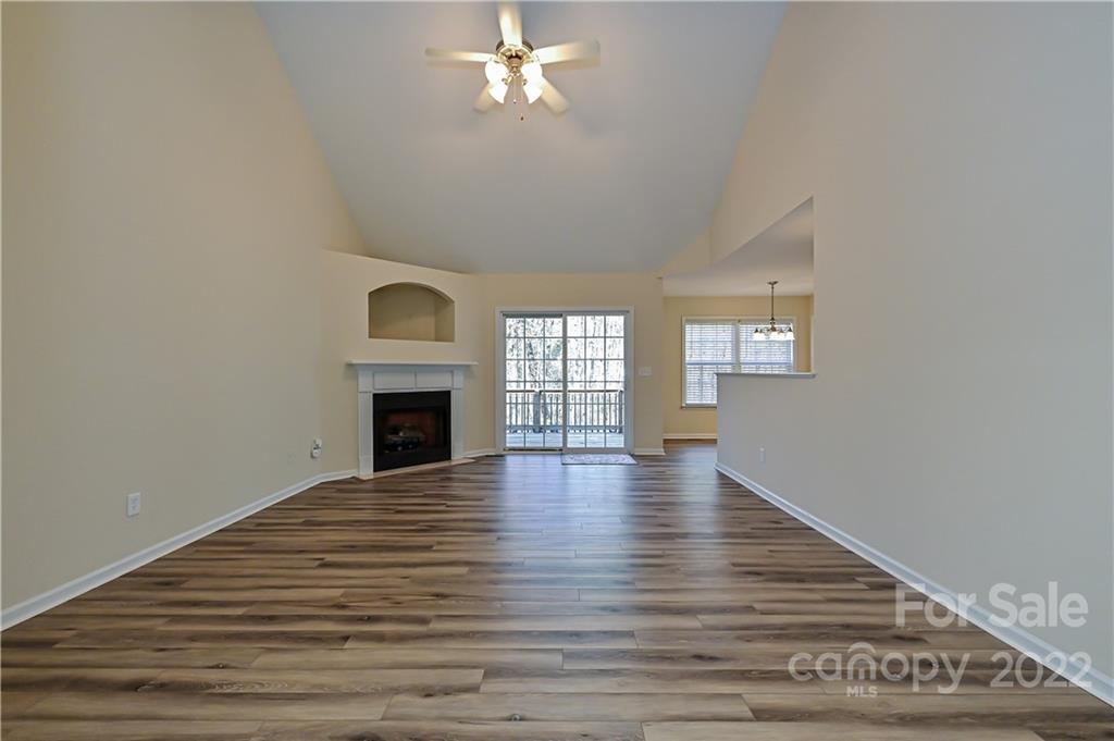 517 Kittiewake Lane Clover, SC 29710 - Photo 7 of 30 a view of empty room with wooden floor and fireplace
