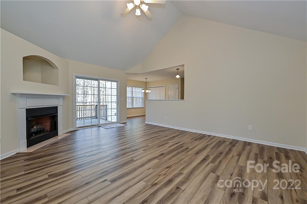 517 Kittiewake Lane Clover, SC 29710 - Photo 8 of 30 wooden floor fireplace and windows in an empty room