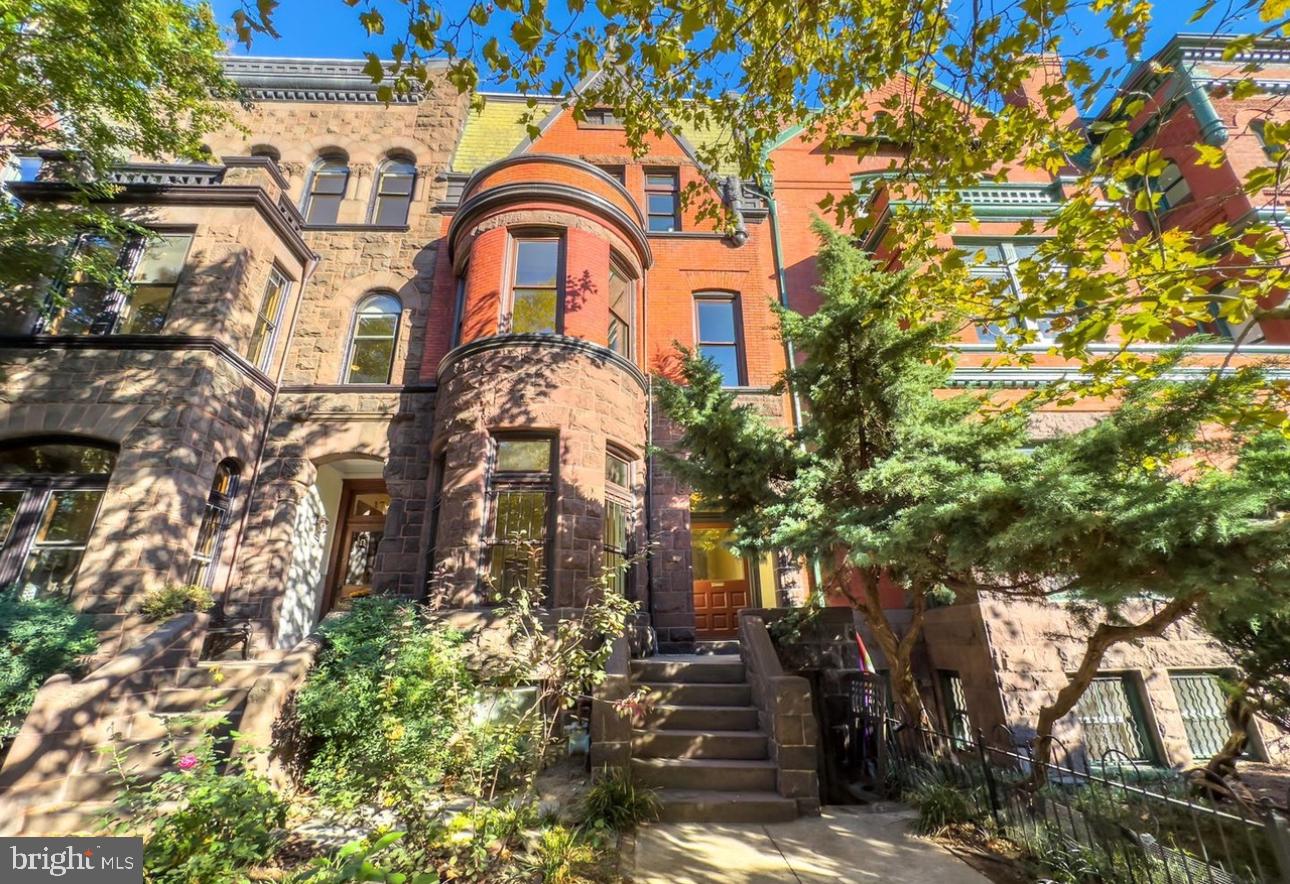 1703 Q Street Northwest Washington, DC 20009 - Photo 1 of 4 a front view of a house with a yard