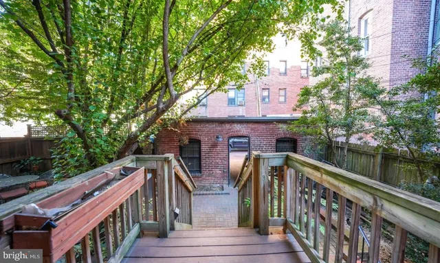 a view of house with outdoor space and lake view