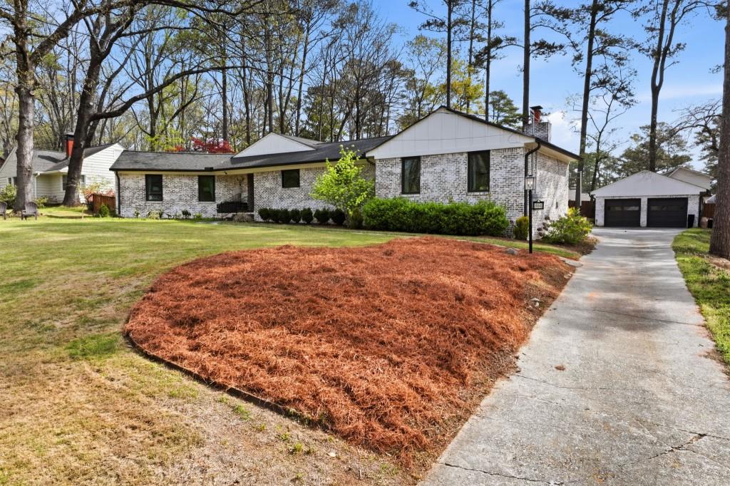 864 Stratford Road Avondale Estates, GA 30002 - Photo 2 of 54 a front view of a house with yard and green space