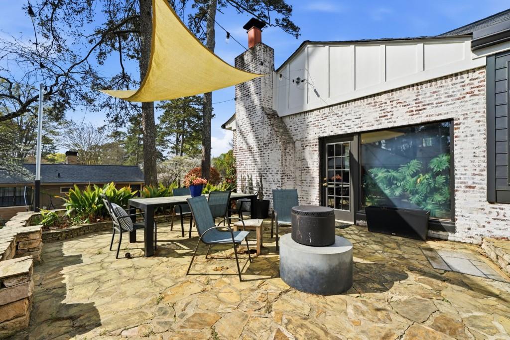 864 Stratford Road Avondale Estates, GA 30002 - Photo 35 of 54 a view of a patio with table and chairs and potted plants