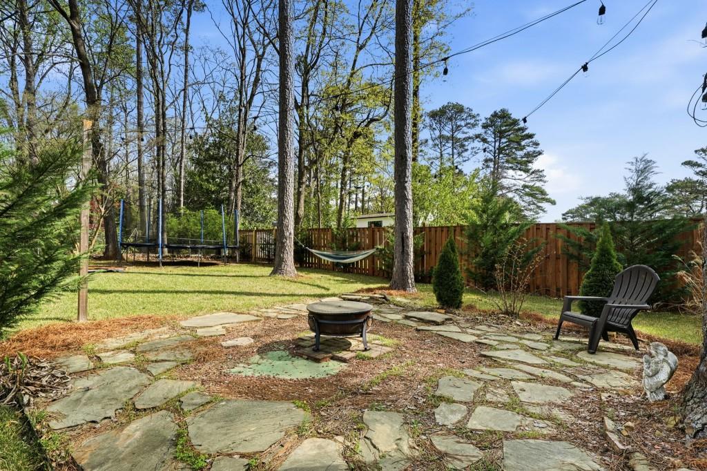 864 Stratford Road Avondale Estates, GA 30002 - Photo 36 of 54 a view of a park with large trees and a bench