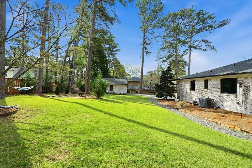 864 Stratford Road Avondale Estates, GA 30002 - Photo 39 of 54 a view of a house with a backyard