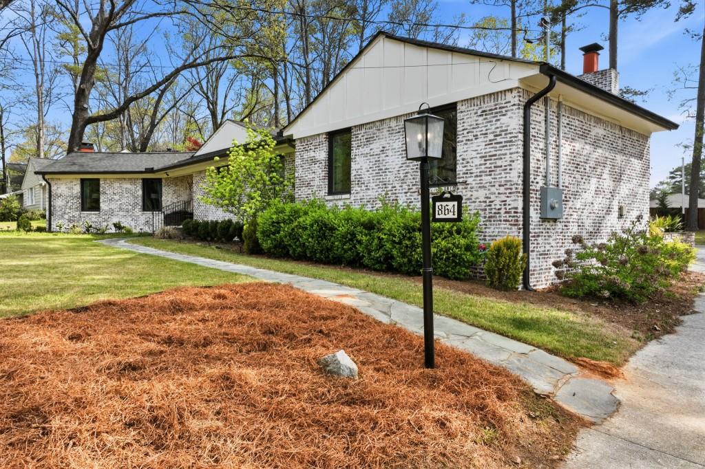 864 Stratford Road Avondale Estates, GA 30002 - Photo 4 of 54 a view of a house with a yard and potted plants