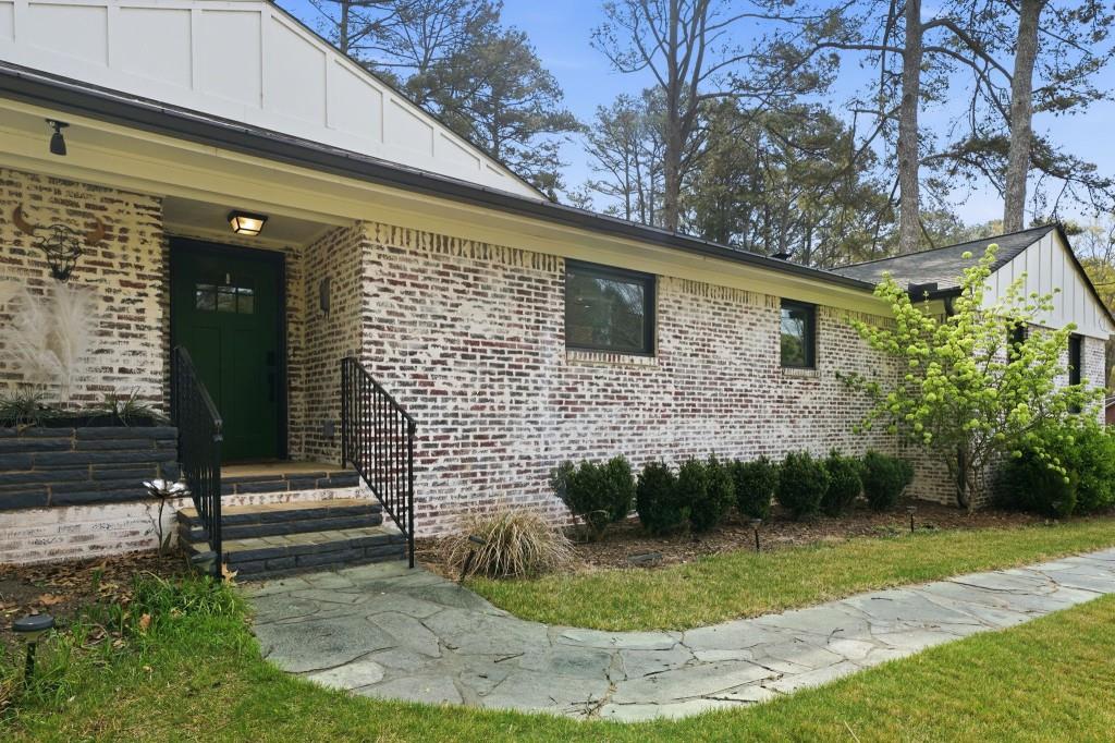 864 Stratford Road Avondale Estates, GA 30002 - Photo 6 of 54 a front view of a house with a yard