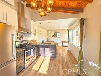 a kitchen with stainless steel appliances granite countertop a stove and a refrigerator