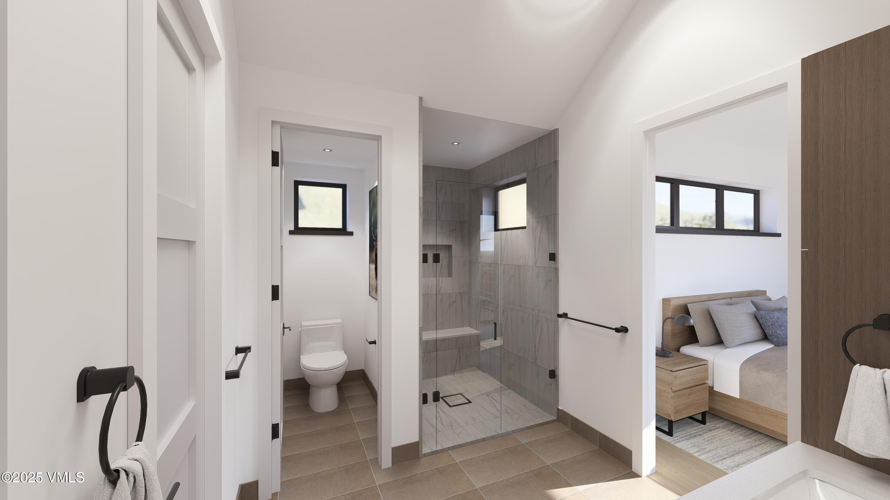 229 Mount Hope Circle Eagle, CO 81631 - Photo 20 of 35 a bathroom with a toilet and a shower