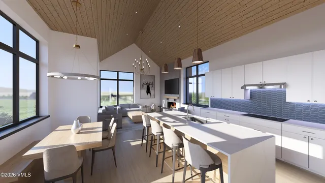 a kitchen with a table and chairs in it