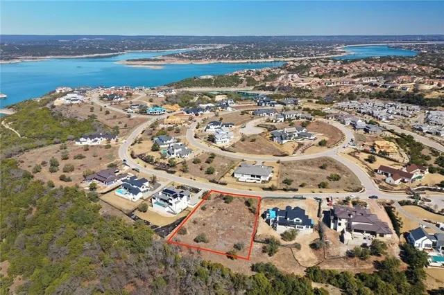 an aerial view of a house with a ocean view